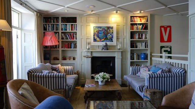 living room with two striped couches